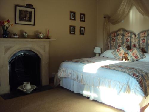 Кровать или кровати в номере Lullington House