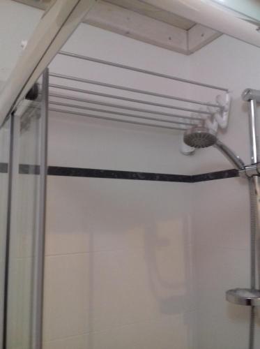 a shower with a shower head in a bathroom at Bed & Breakfast Le Torri in Otranto