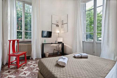 Llit o llits en una habitació de Lucca in Villa Lucrezia