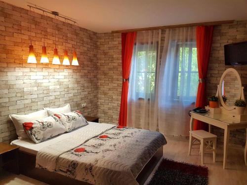 Tempat tidur dalam kamar di Hotel Minaliat Vek