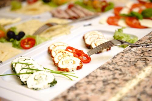 a plate of food on a counter with a plate of food at Parkhotel Pyrmont in Bad Pyrmont