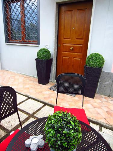 a table and chairs in front of a door at Sleep And Fly Rome Airport in Fiumicino