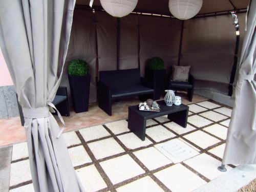 a room with a couch and a table in a tent at Sleep And Fly Rome Airport in Fiumicino