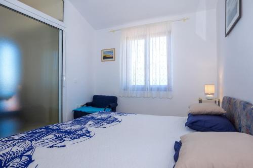 Posteľ alebo postele v izbe v ubytovaní Vidučić Apartments