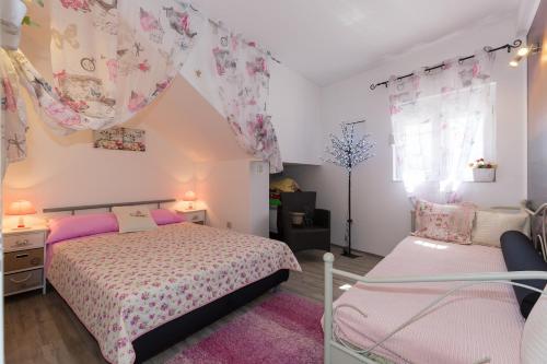 Postel nebo postele na pokoji v ubytování Apartment Nedo