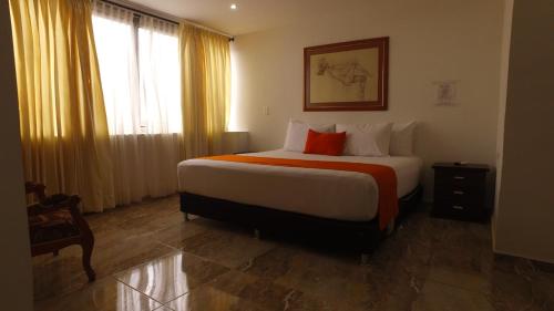 Ένα ή περισσότερα κρεβάτια σε δωμάτιο στο Hotel Cafe Plaza