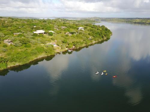 an aerial view of a river with boats in it at Naara Eco Lodge & Spa in Chidenguele