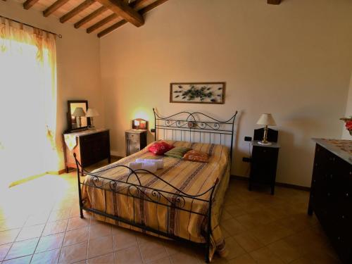 a bedroom with a bed in a room at Farmhouse in Lazio with Lake Bolsena Views in Montefiascone