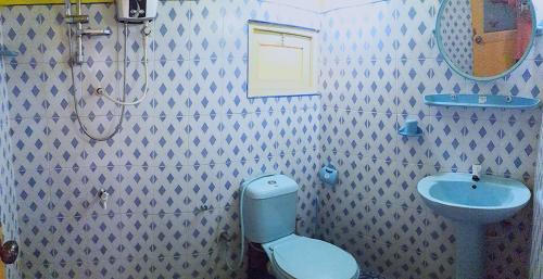 Ένα μπάνιο στο Apple Sara Home Stay