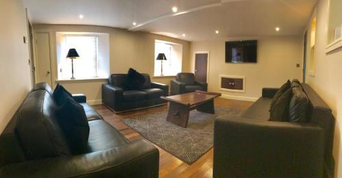 
a living room filled with furniture and a couch at No. 14 in St. Andrews
