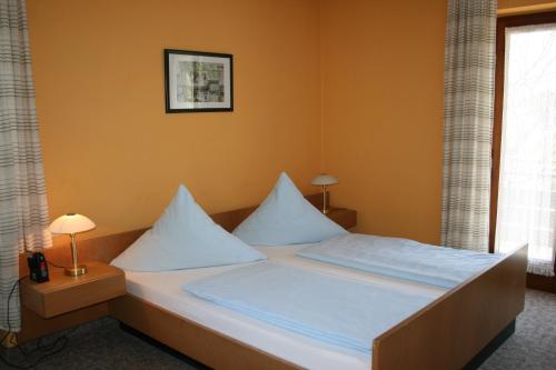 Postelja oz. postelje v sobi nastanitve Bergener Hof