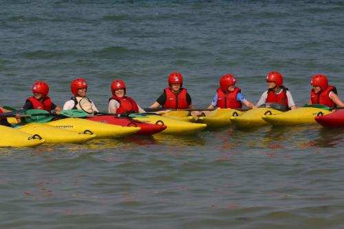 a group of people in kayaks in the water at Dufferin Coaching Inn in Killyleagh