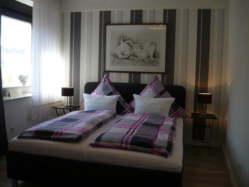 
A bed or beds in a room at Altes Weingut An Der Vogtei

