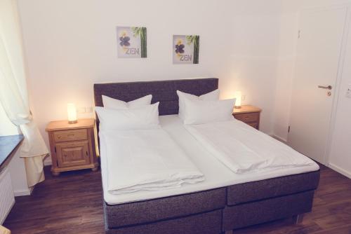 Кровать или кровати в номере Hotel Garni Reis