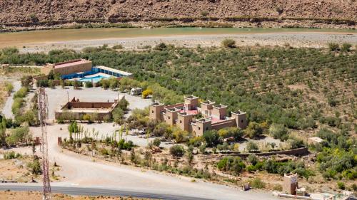 an aerial view of a building in the desert at Kasbah Hotel Camping Jurassique in Ifri