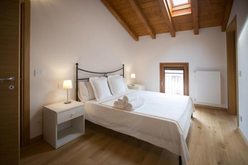Postel nebo postele na pokoji v ubytování Agriturismo Mestroni