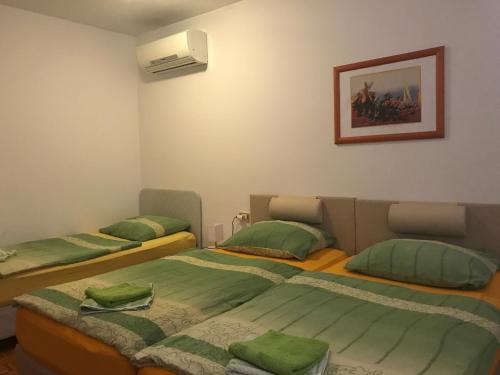 Säng eller sängar i ett rum på Apartment Apollonio Portorož
