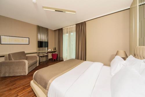 Ένα ή περισσότερα κρεβάτια σε δωμάτιο στο The City Suites
