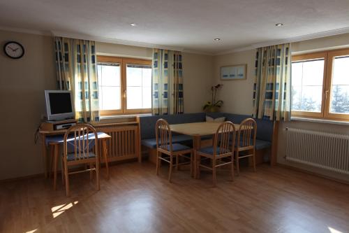 a dining room with a table and chairs at Haus Helga in Kappl