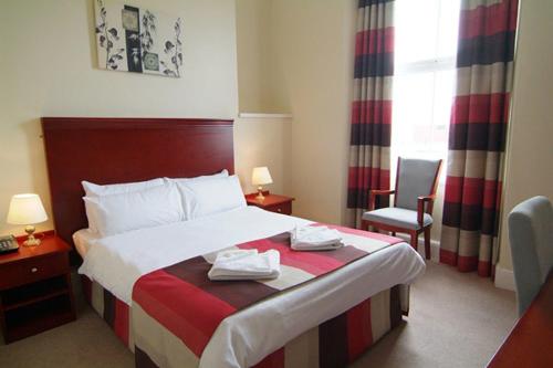 Cama o camas de una habitación en Kensington Hotel