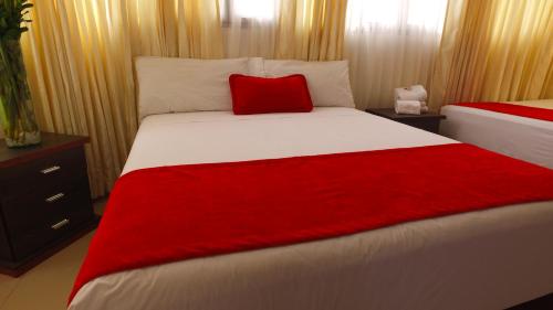 Ένα ή περισσότερα κρεβάτια σε δωμάτιο στο Hotel Cafe Plaza