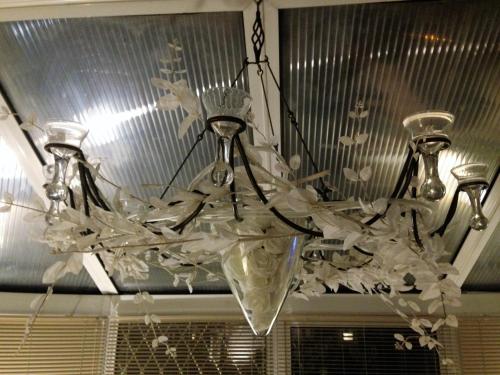 a chandelier is hanging from a ceiling at The Old Coach House in Blackpool
