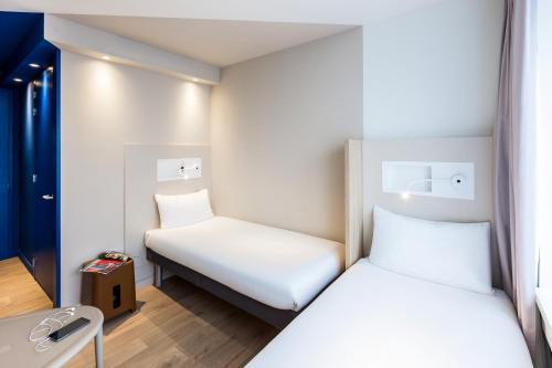 Кровать или кровати в номере ibis budget Amsterdam City South