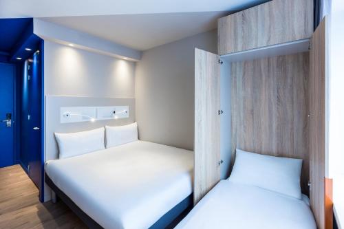 Кровать или кровати в номере ibis budget Amsterdam City South