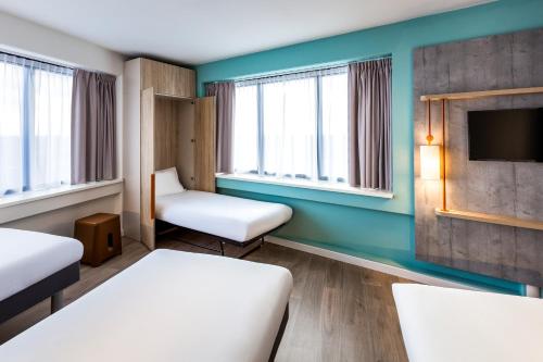 Кровать или кровати в номере ibis budget Amsterdam City South