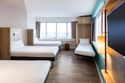 Кровать или кровати в номере ibis budget Amsterdam City South