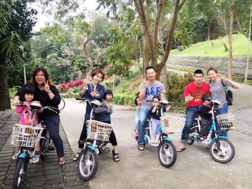 a group of people riding bikes at Tamowan in Donghe