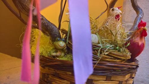 a basket with eggs and chickens in it at Antichi Feudi Dimora D'Epoca in Teggiano