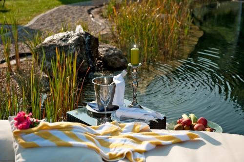 a picnic table with a candle and a candle at Romantikhotel Residenz Wachau in Aggsbach Dorf