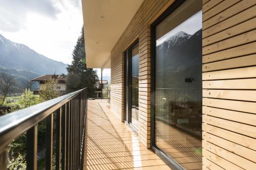 a balcony with a view of the mountains at Haus am Stein in Oetz