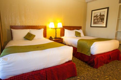a hotel room with two beds in a room at Jackson Lake Lodge in Moran