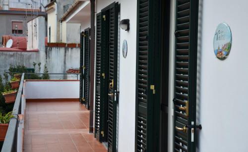 a row of green shutters on a building at B&B Cetara Amalfi Coast in Cetara