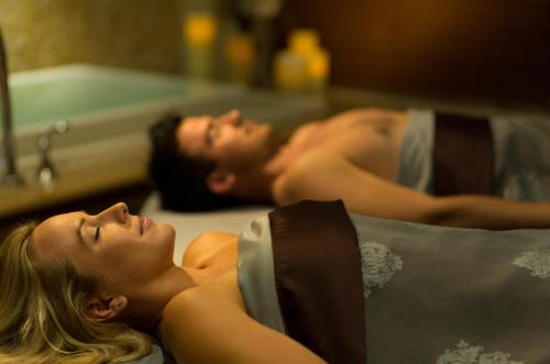 a man and woman laying in a bath tub at Margaritaville Beach Resort South Padre Island in South Padre Island