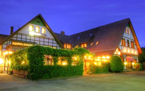 a large building with lights on it at night at Hotel Vivendi in Herford