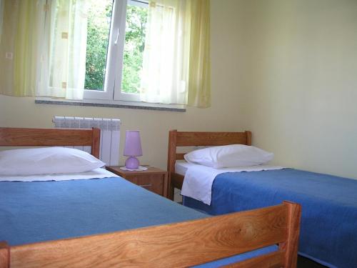 Postel nebo postele na pokoji v ubytování Apartman Belići