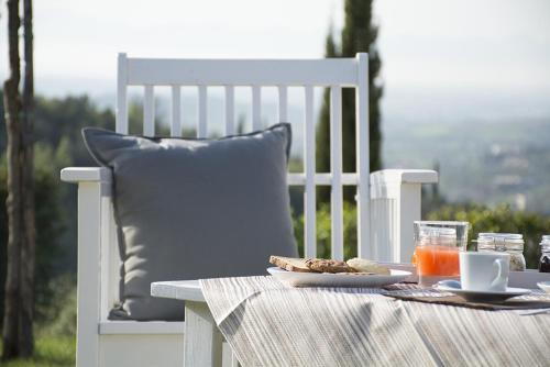 a white table with a plate of food and a drink at B&B casa73 in Cicerale
