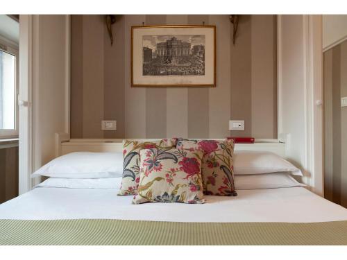 Postel nebo postele na pokoji v ubytování Hotel Kennedy