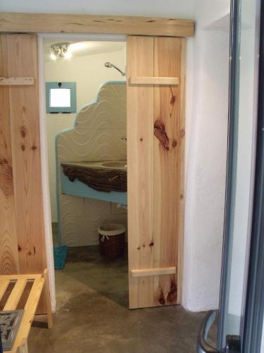 a room with a bed in a room with a closet at TerraFazBem in Marvão