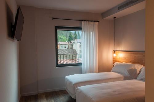 Un pat sau paturi într-o cameră la Hotelet de Sant joan
