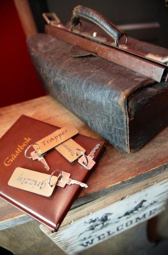 a couple of old leather bags sitting on a table at J A Ranch Bed & Breakfast in Strömsnäsbruk