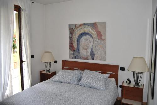 เตียงในห้องที่ Appartamento Savoia Salò
