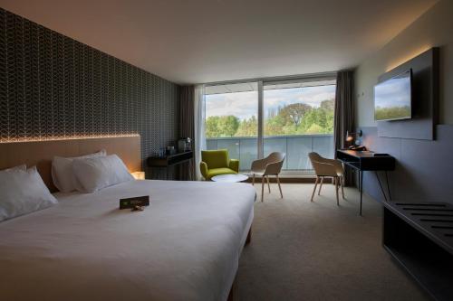Postel nebo postele na pokoji v ubytování ibis Styles Kortrijk Expo