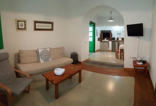 a living room with a couch and a table at Casa Villalba in San Bartolomé