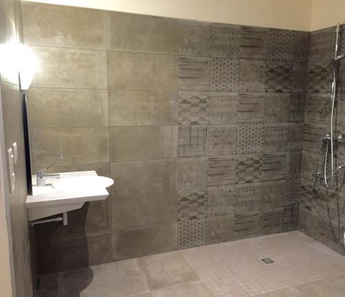 a bathroom with a sink and a shower at Les Villas MarInCelu in Porto Pollo