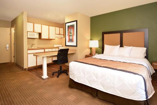 a hotel room with a bed and a desk at Extended Stay America Suites - Birmingham - Wildwood in Birmingham