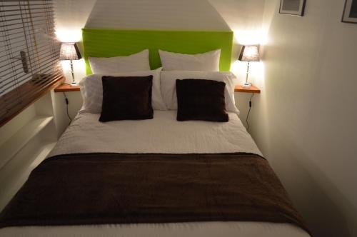Llit o llits en una habitació de Appartement Larzilliere